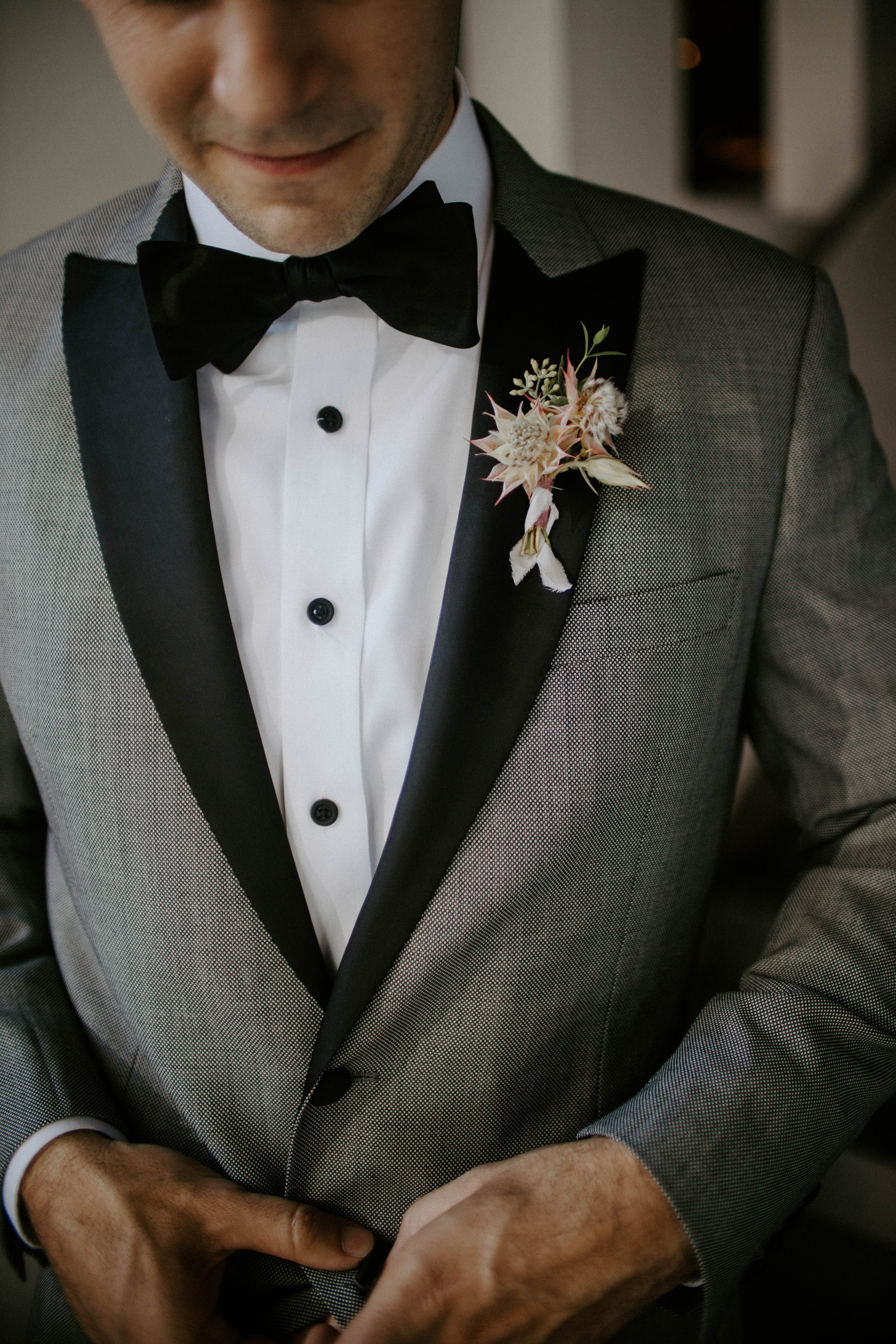 blushing bride protea boutonniere.jpg