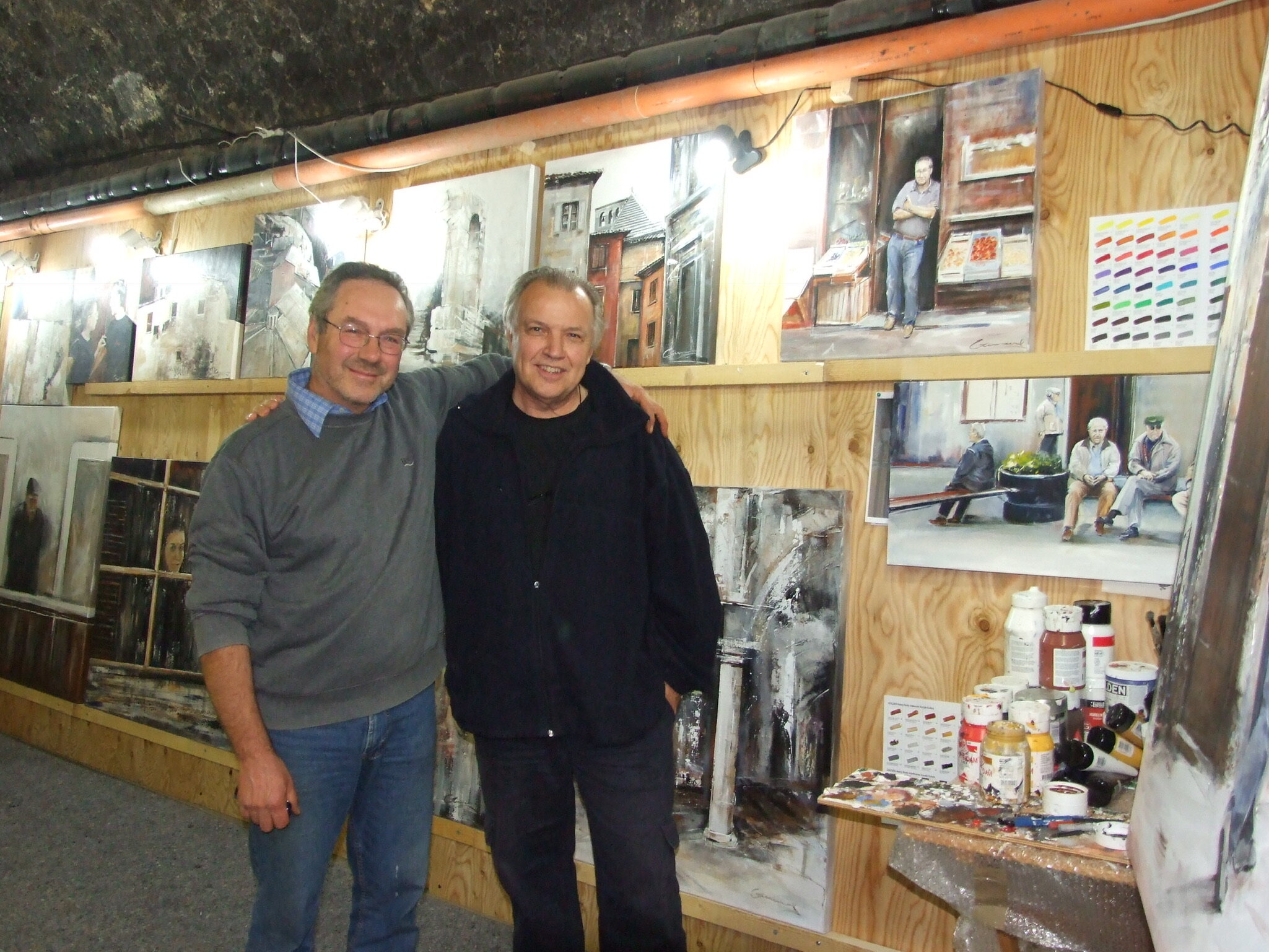  In the subterranean painting studio, Orvieto with Enrico, the subject of one of many portraits of the locals in Orvieto. His portrait is hanging above Victor’s left shoulder.  