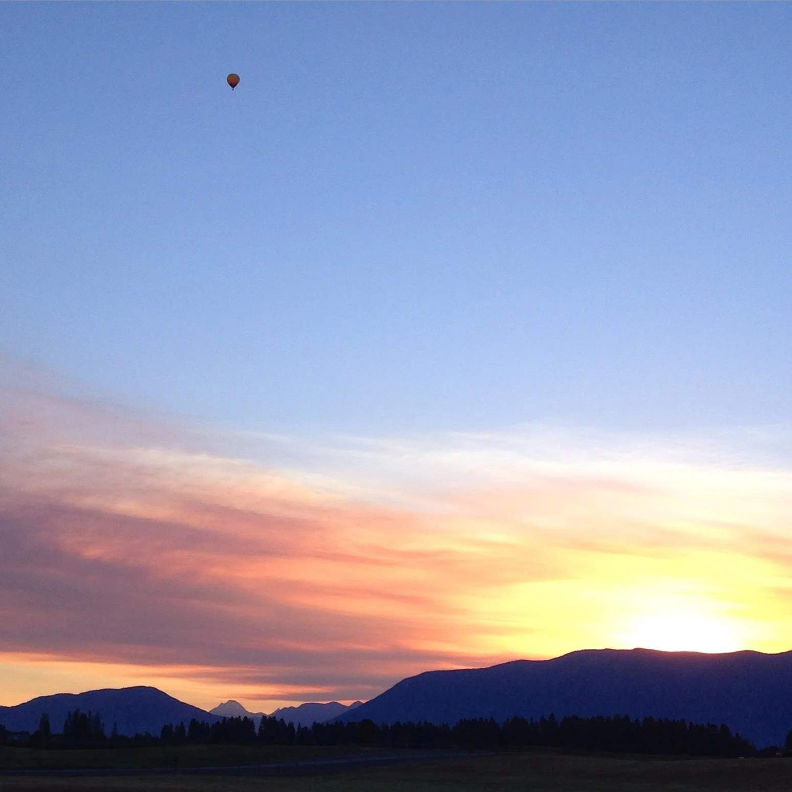  Sunrise flight outside of Glacier National Park in Montana 