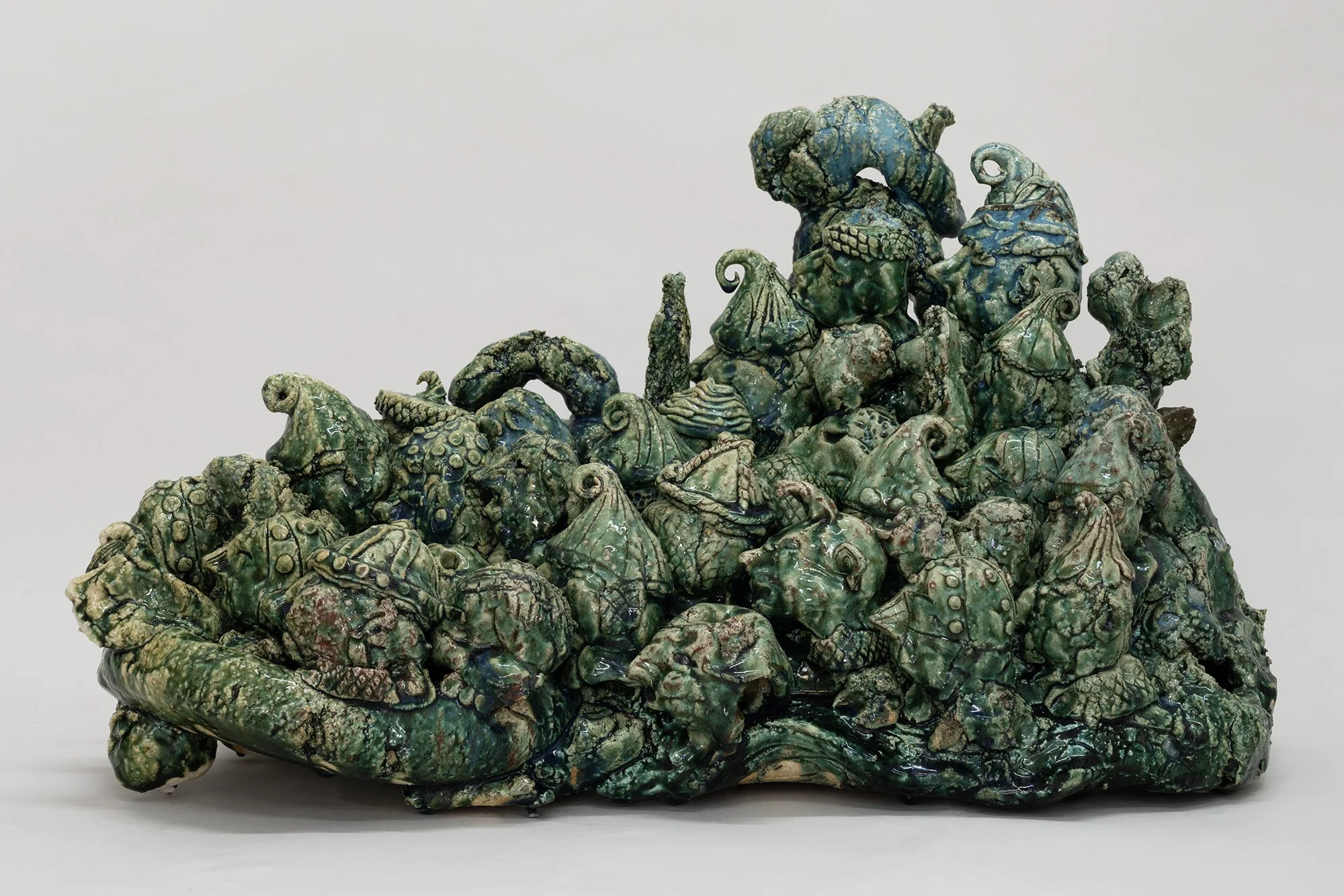 Abilità Negativa 3 , 2025 Oribe Lightly reduced stoneware with feldspathic and hagi sand inclusions, copper saturate glaze, pine needle ash, post-firing acid soak 35 x 59 x 32 cm