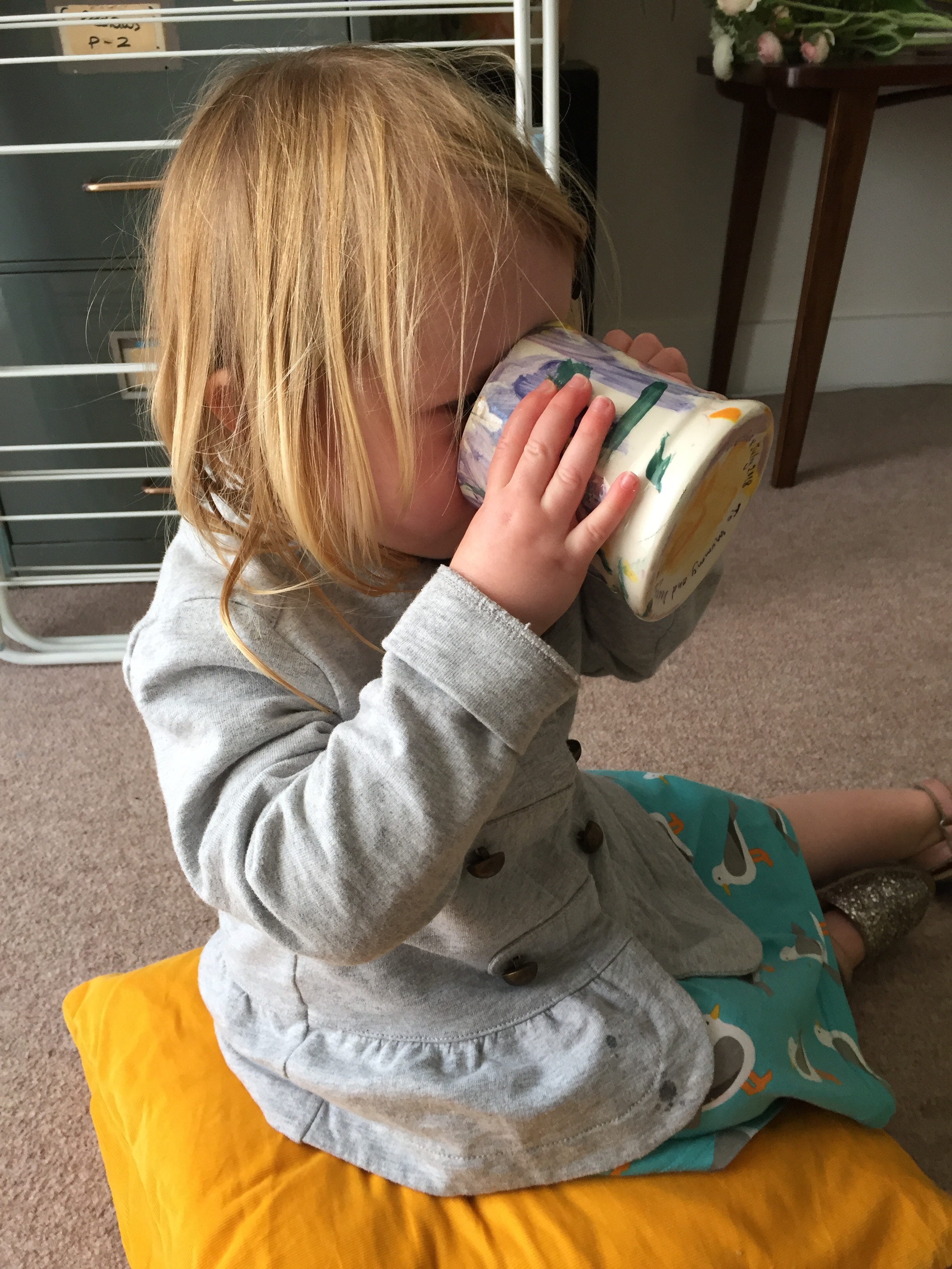 hand painted up child the pottery experience.JPG