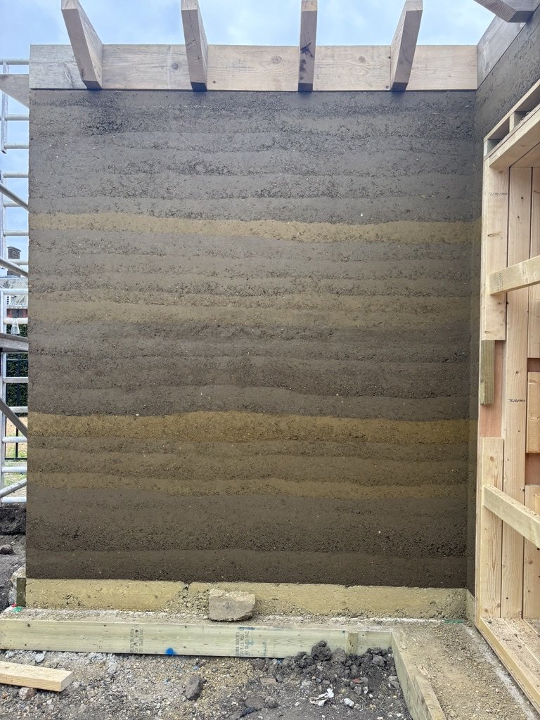 rammed earth wall with the shuttering just taken off