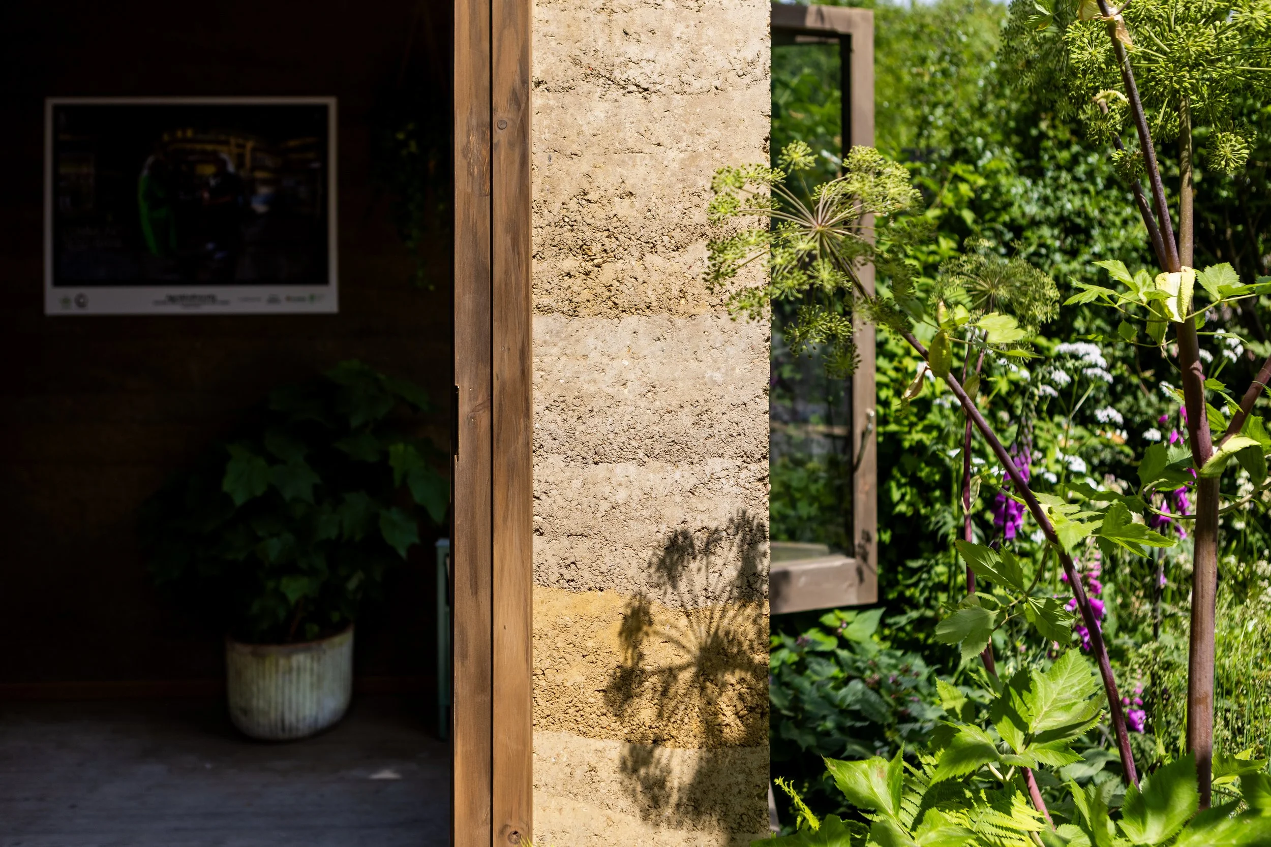 rammed earth side view of building and door way