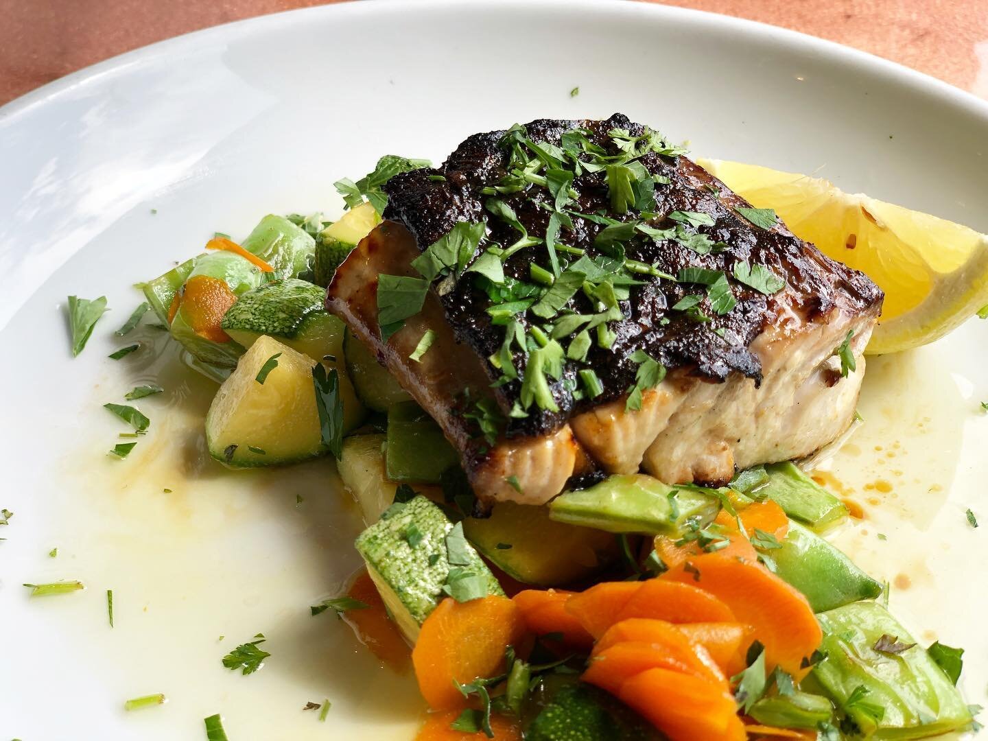 Looking for something light &amp; clean after a gluttonous summer?Grilled Yellowtail Amberjack is on our specials menu this week.  Refined with a plum glaze and served with summer vegetables in a lemon butter-parsley sauce. 😋