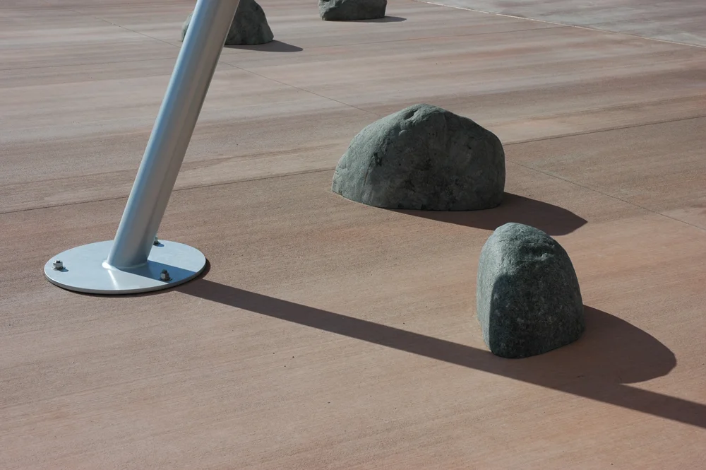 Granite boulders strewn around the base of the spaceship provide seating and create a fictional alien landscape.