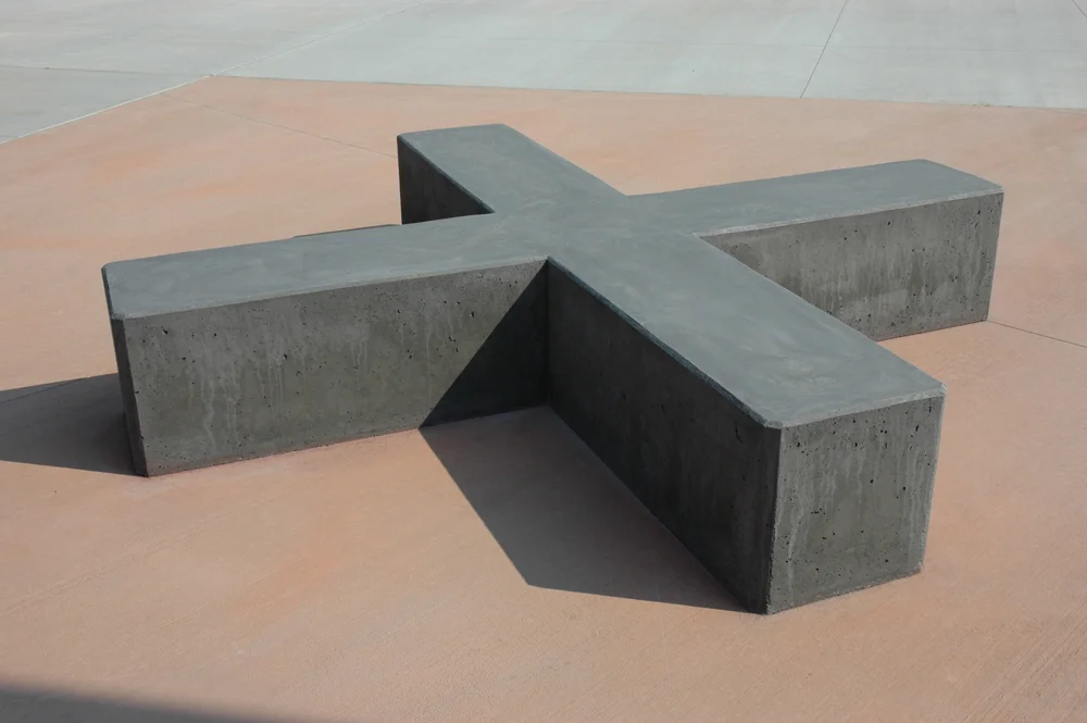 A concrete bench in the form of an "X" marks the fictional landing zone.