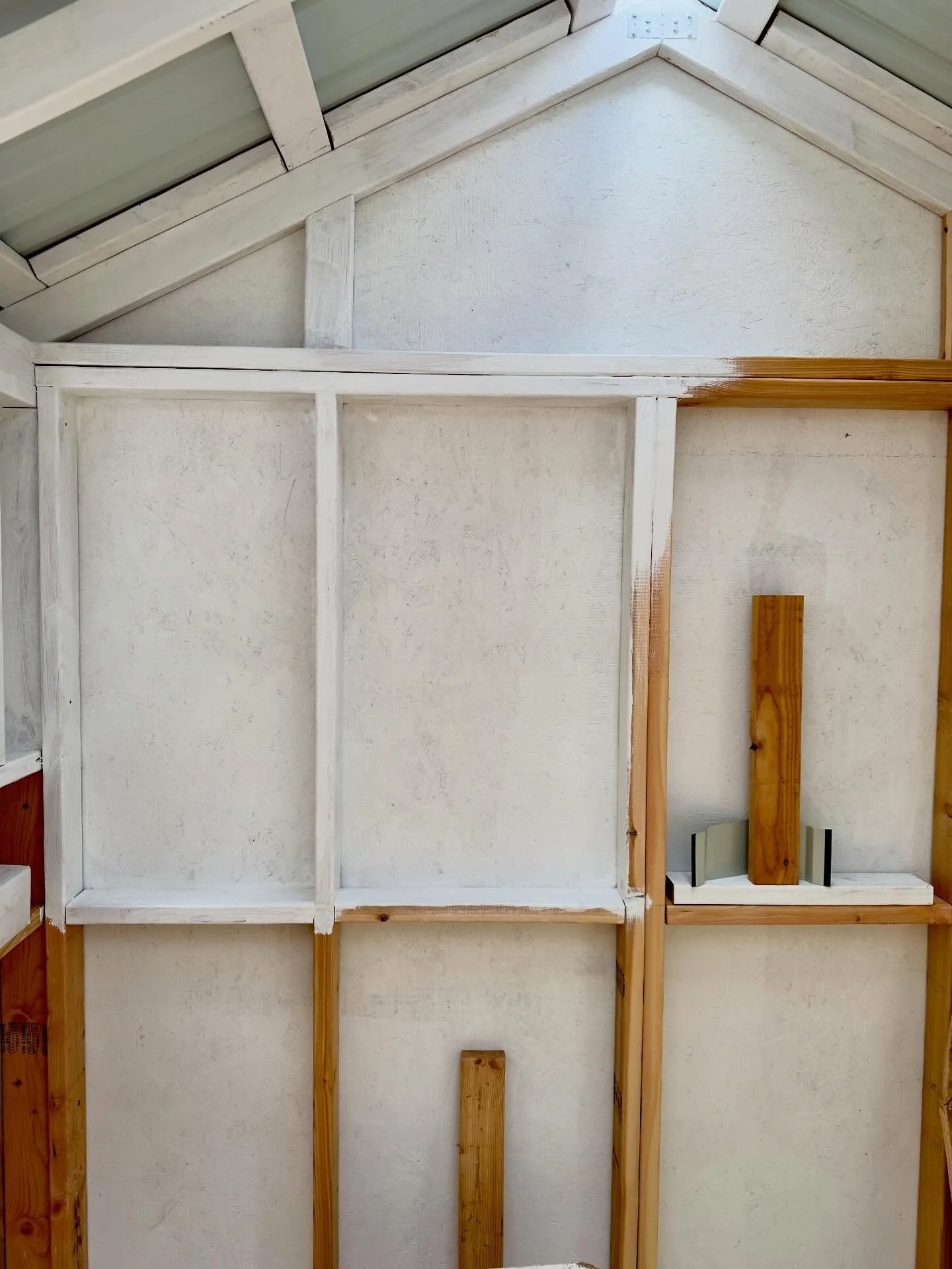 Taking advantage of a nice 60 degree day to paint inside of potting shed.