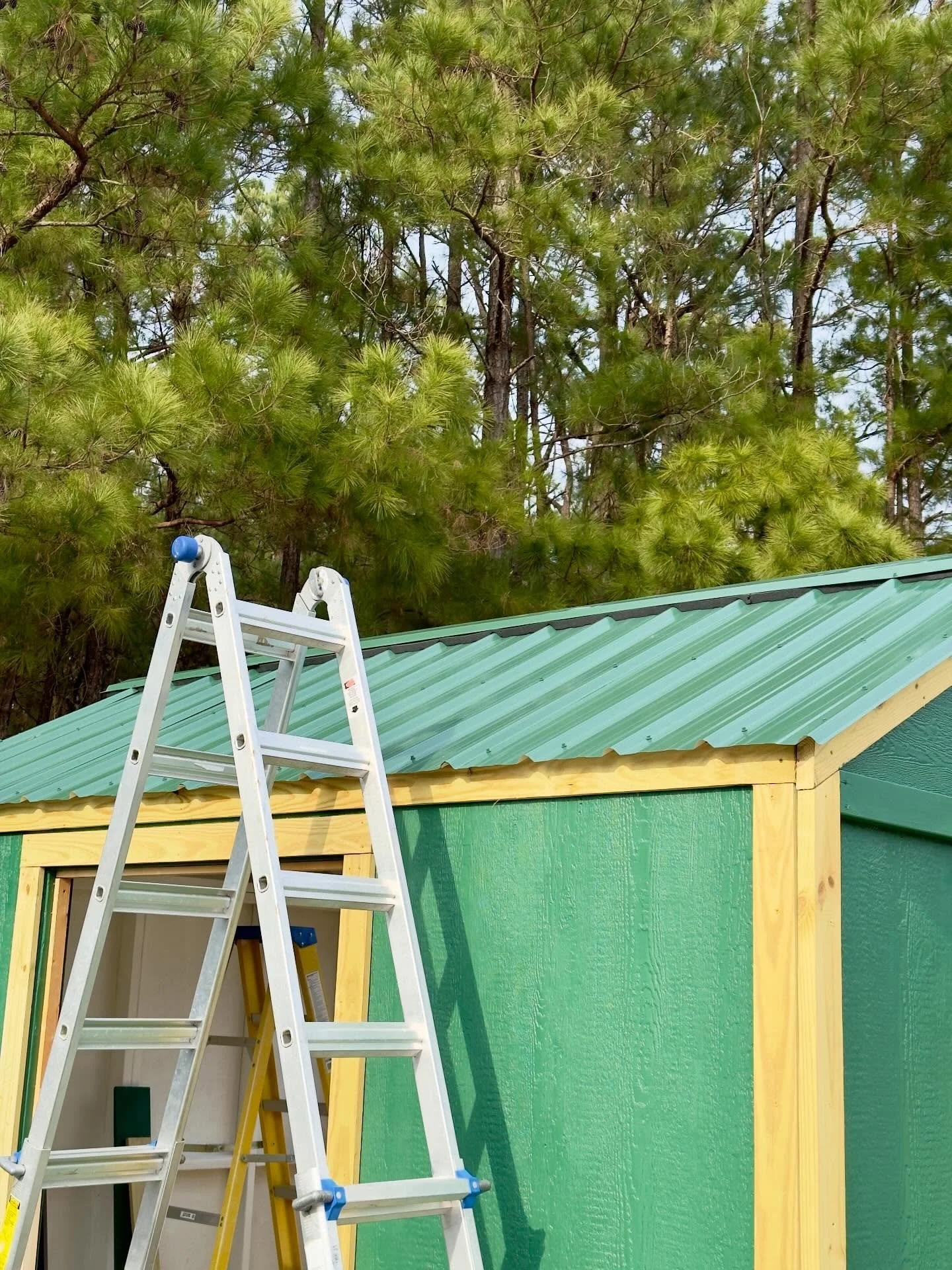 Adding the roof cap. Did I mention I&rsquo;m not fond of heights? 😬