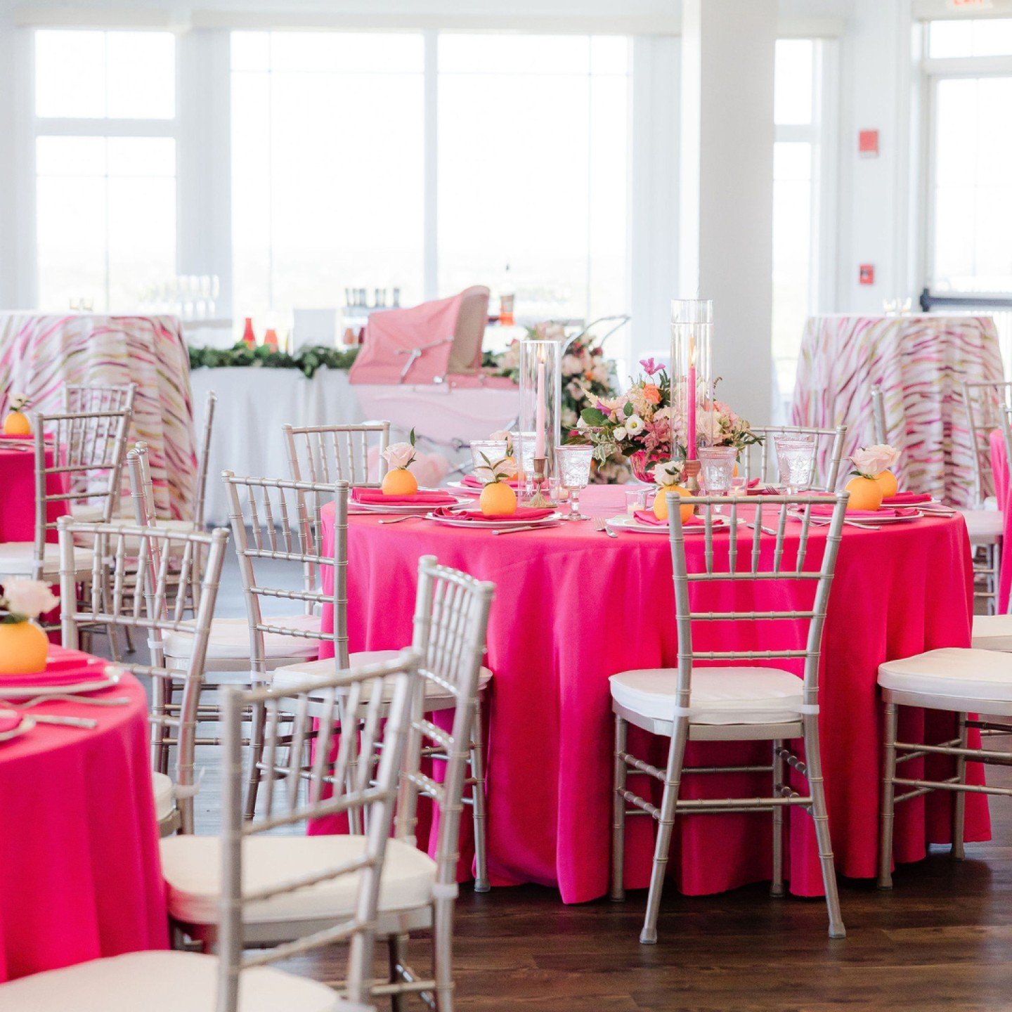 A chic room adorned with a variety of bold and interesting details set the scene for B's vibrant baby shower.

The mix of soft blush tones, bright fuchsias, cheerful oranges, and various contrasting linens created a unexpected, yet inviting atmospher
