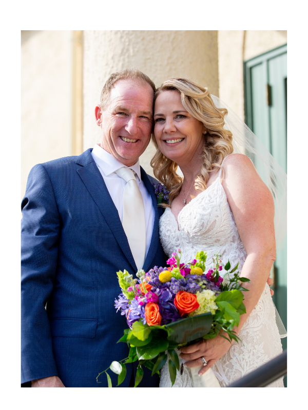 Bride and Groom with colorful flowers at church in Dracut MA