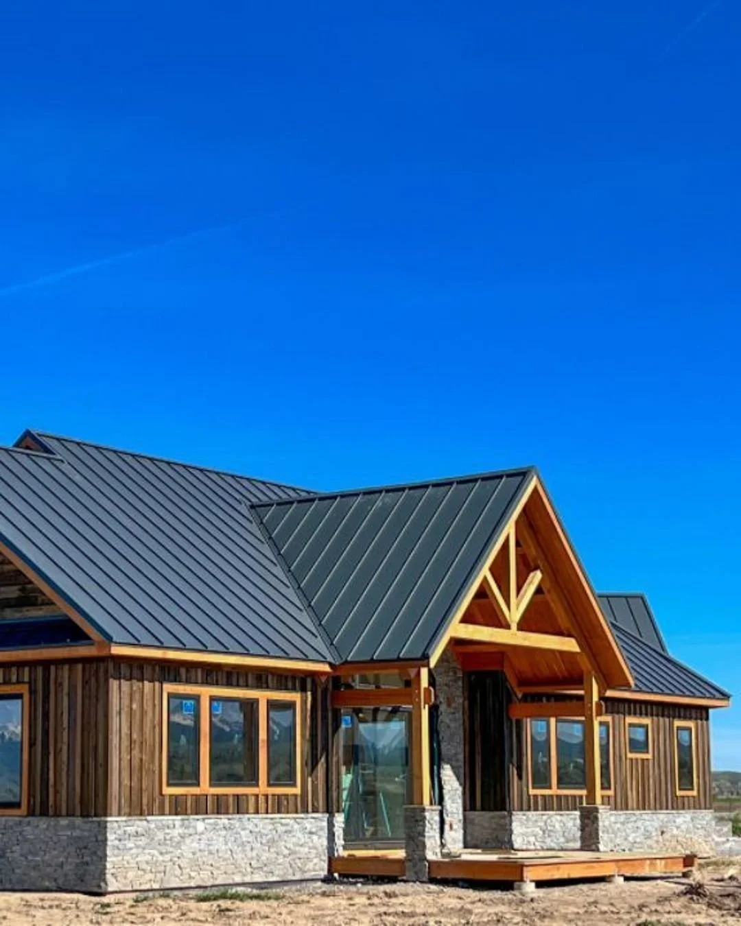 This off-grid home blends timeless timber craftsmanship with modern performance. Heavy timber trusses anchor the entry, living room, and back deck, while local Oakley stone and board &amp; batten siding root the design in Idaho&rsquo;s rugged beauty.