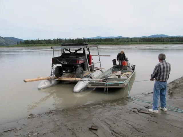 Raft tied to the boat and ready to launch.