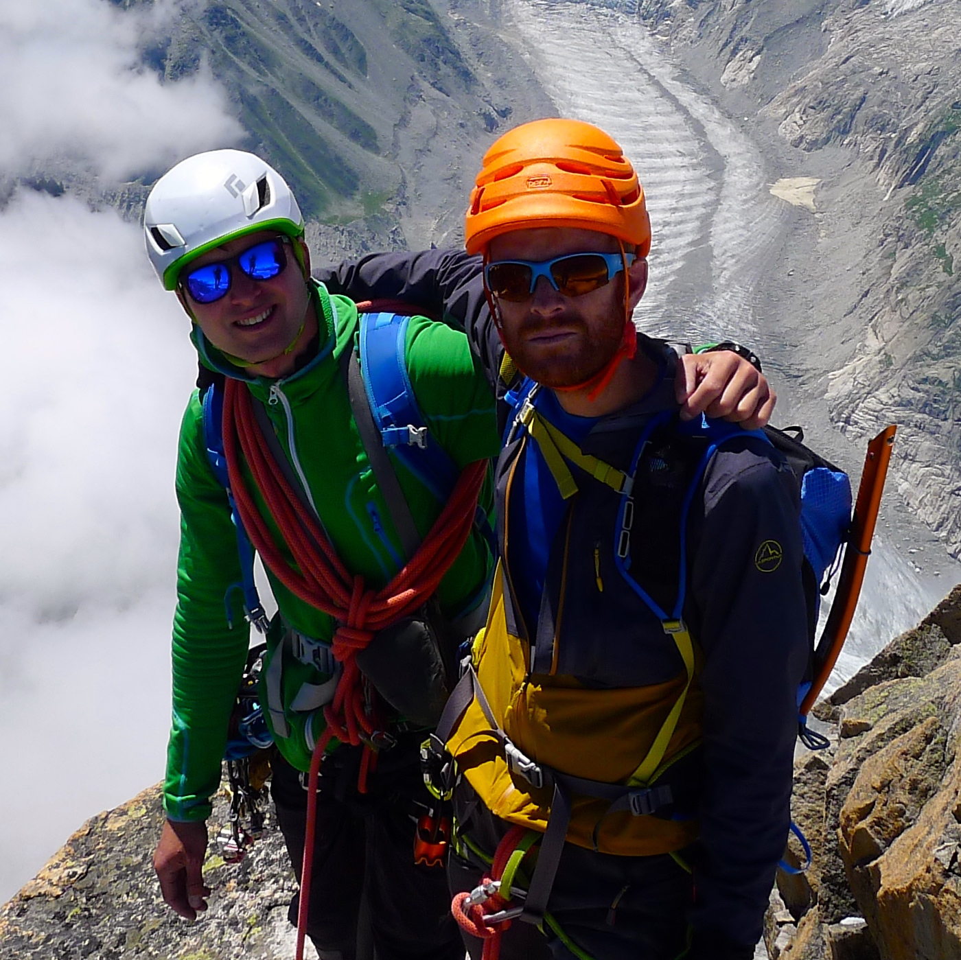 Sam and Neil near the summit of the Dru. The Panorama behind stretches all the way from the Grande Jorasses on the left to Mont Blanc on the right..jpg