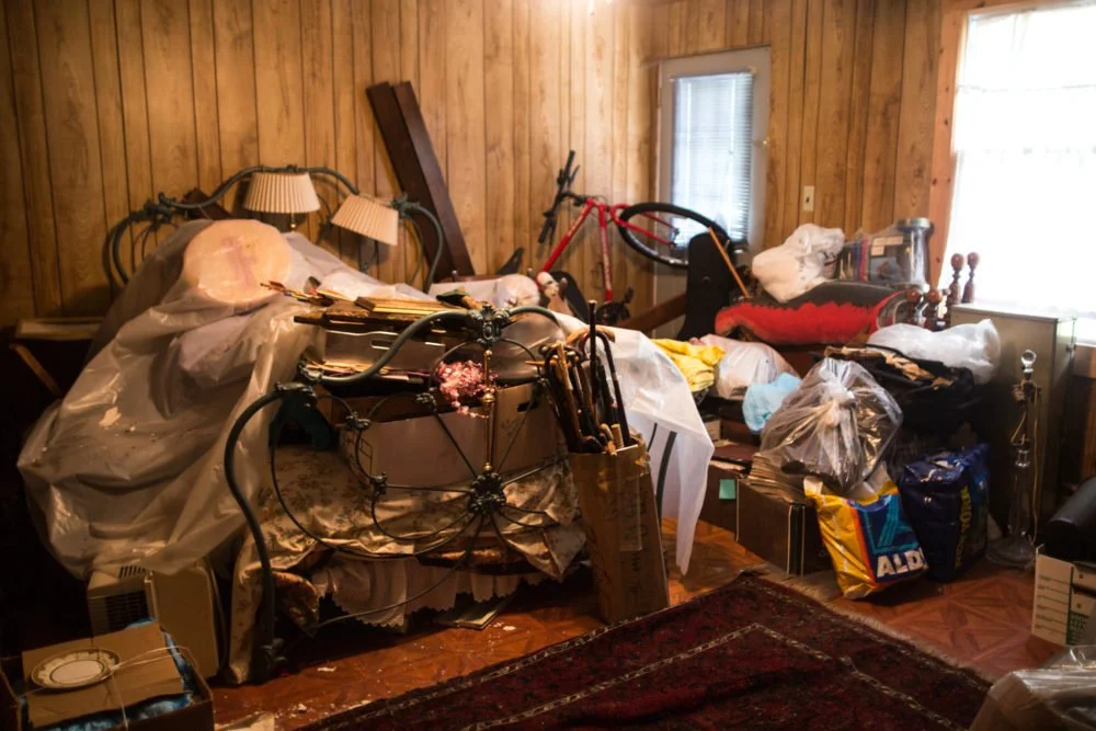 One of the many rooms inside the houses of a seller, Alan. This house was used for storage only and was covered wall-to-wall with items he had picked up in his years working estates .