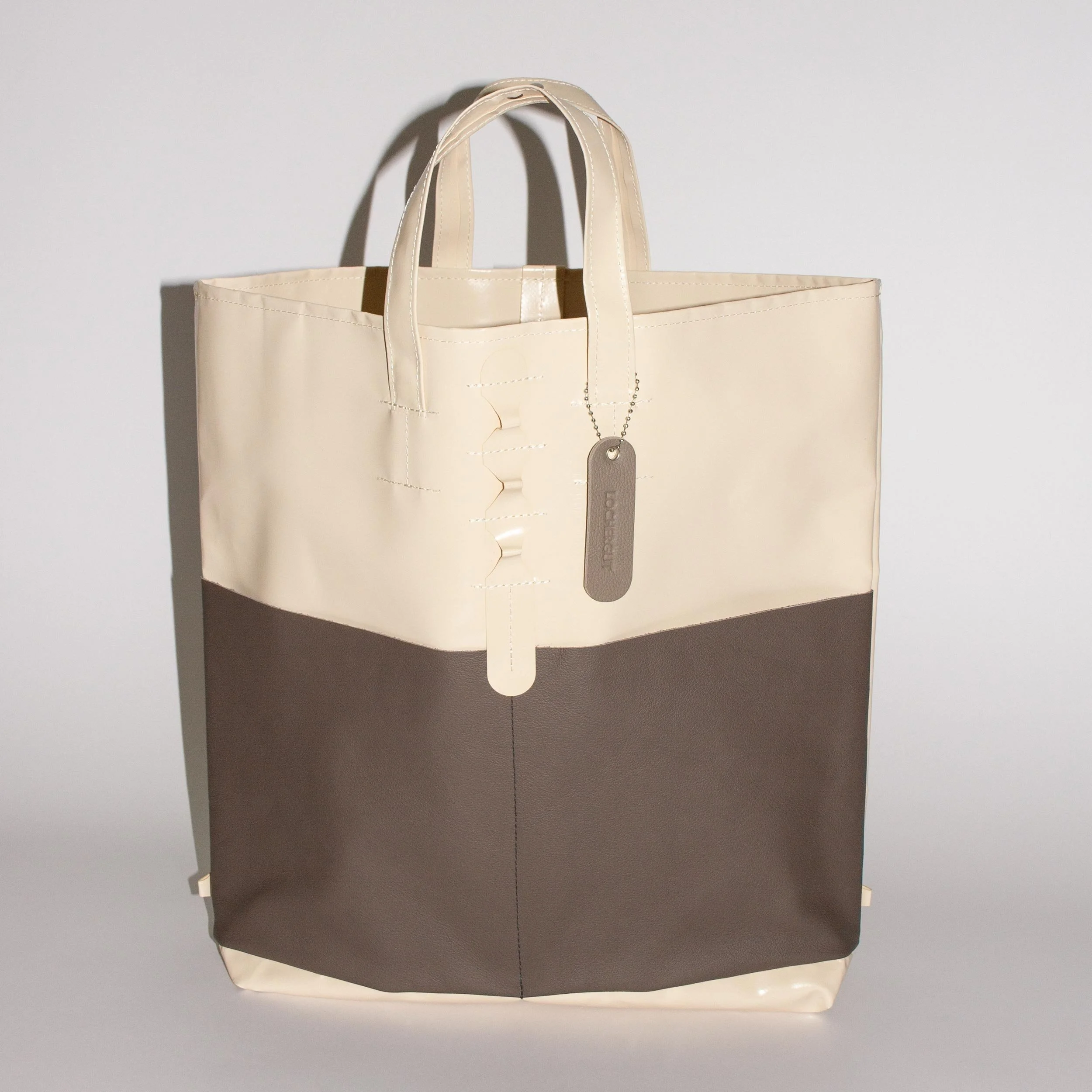 POWCH_Bag-Tag_Warm-Grey_in-use.jpg (Copy)