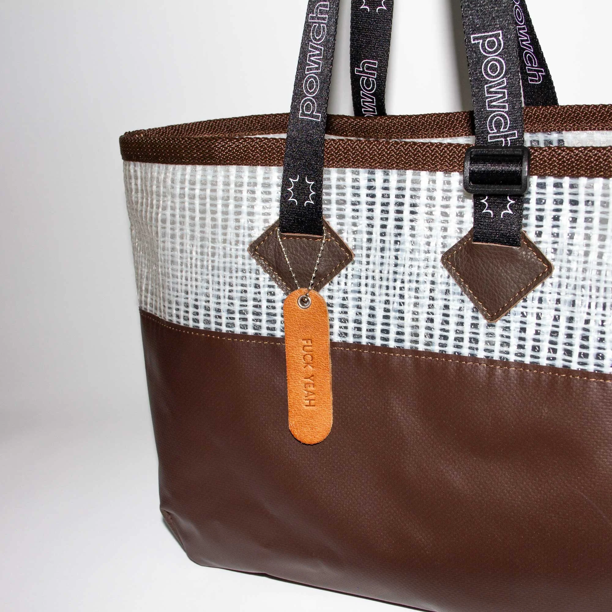 POWCH_Bag-Tag_Pale-Brown_in-use.jpg (Copy)