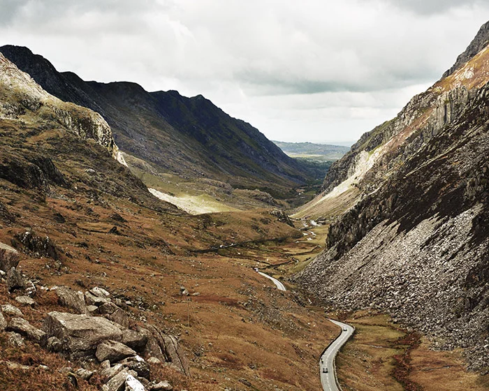 This image shows a slightly elevated view from a trail on Mt Snowdon in Wales - this iconic view is only visible from just walking for 10 minutes up a well maintained trail.