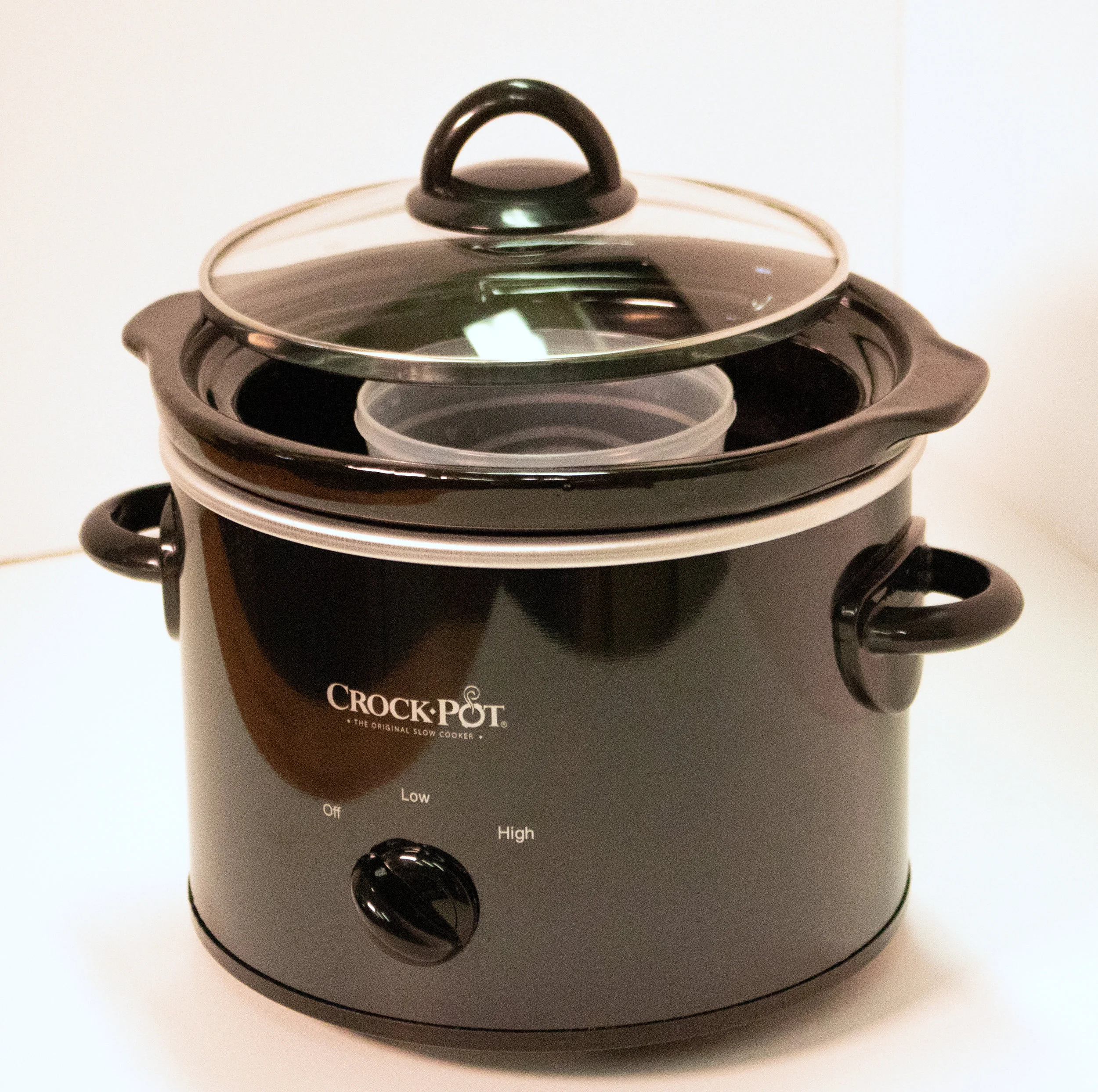Crock-pot with plastic container placed inside for a double-boiler set-up.