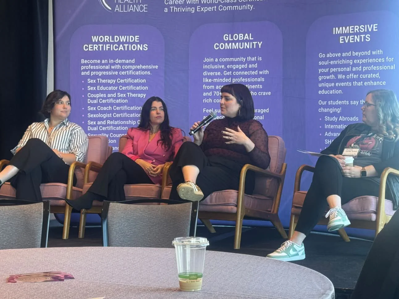 Four women sitting for a smut panel