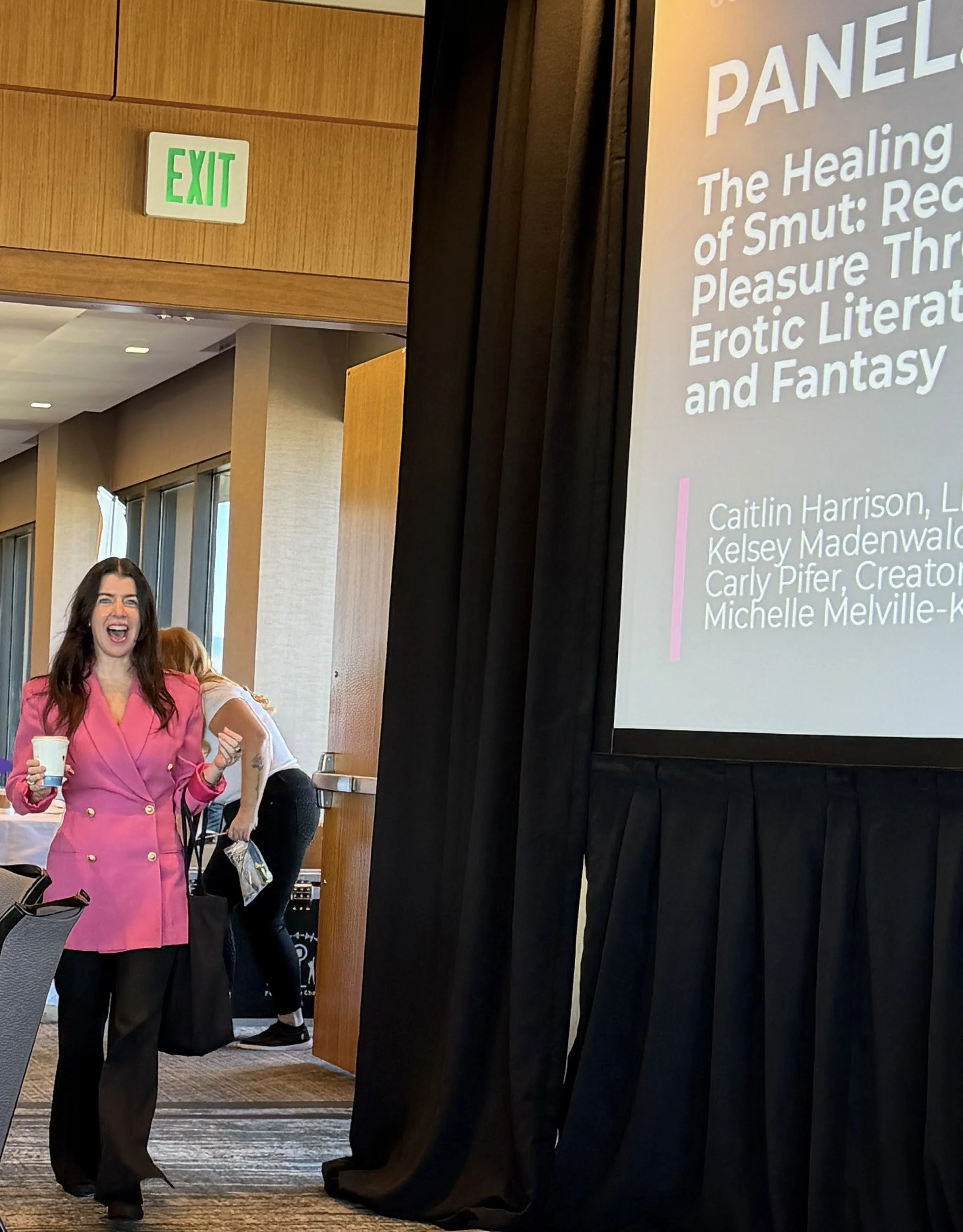 Walking into a smut panel in a pink blazer and happy face