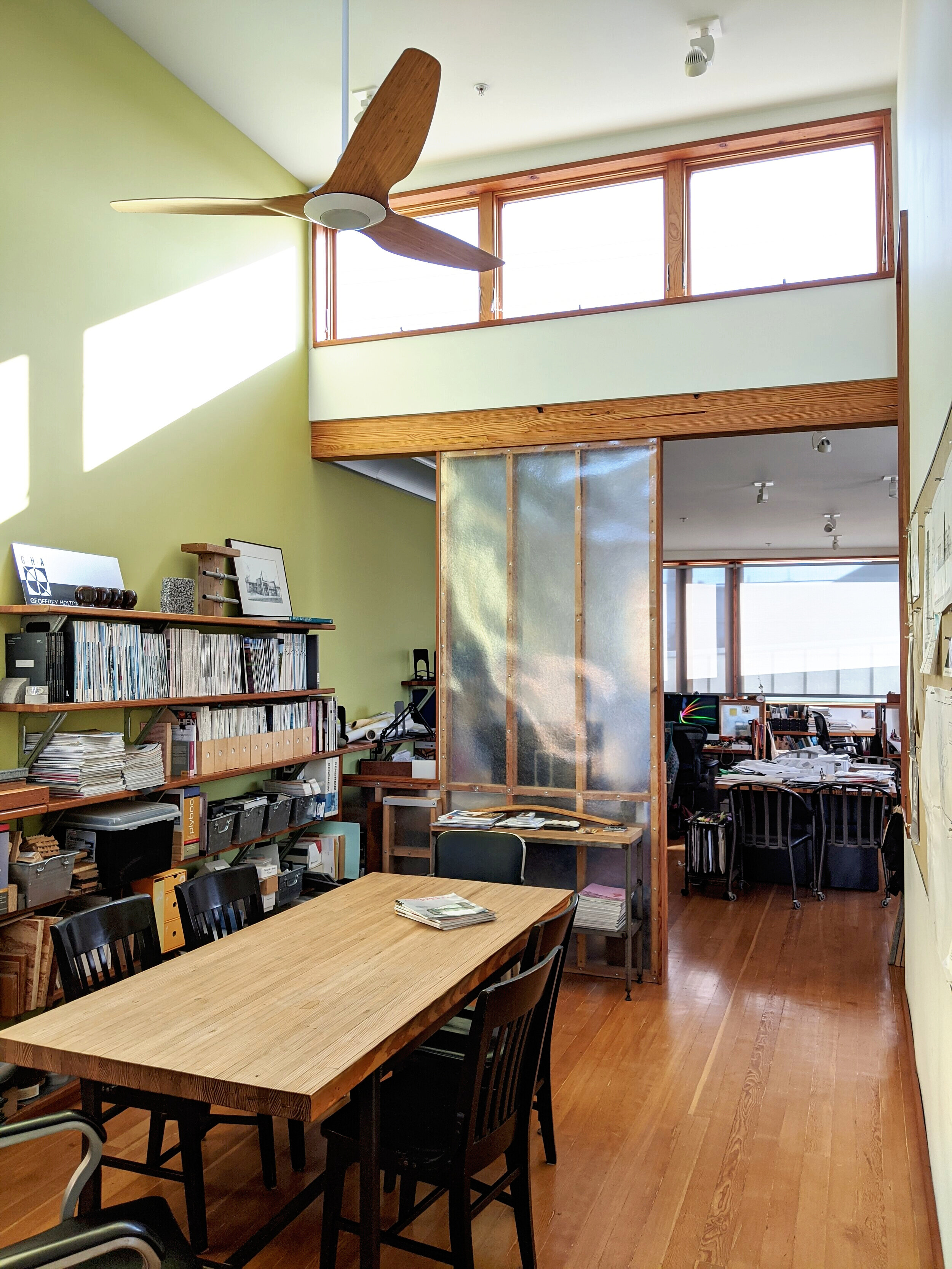 New second-story offices are naturally ventilated and daylit. The renovation introduces a 15kW photovoltaic array, heat-pump heating and cooling at the ground floor, a high efficiency boiler and radiant heat at second floor and upgrades to the buil