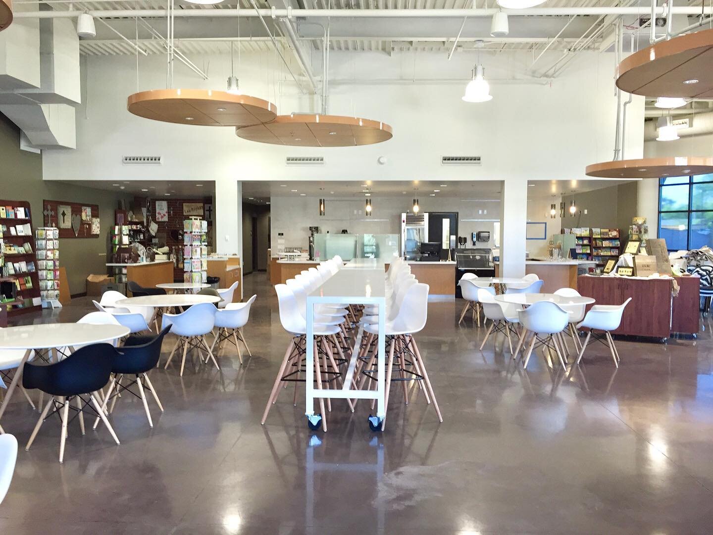 Relaxed cafe and gathering space. I designed this community table which can be repositioned for various purposes and space maximization. Black seating chairs in final photo are @newpacificdirect.