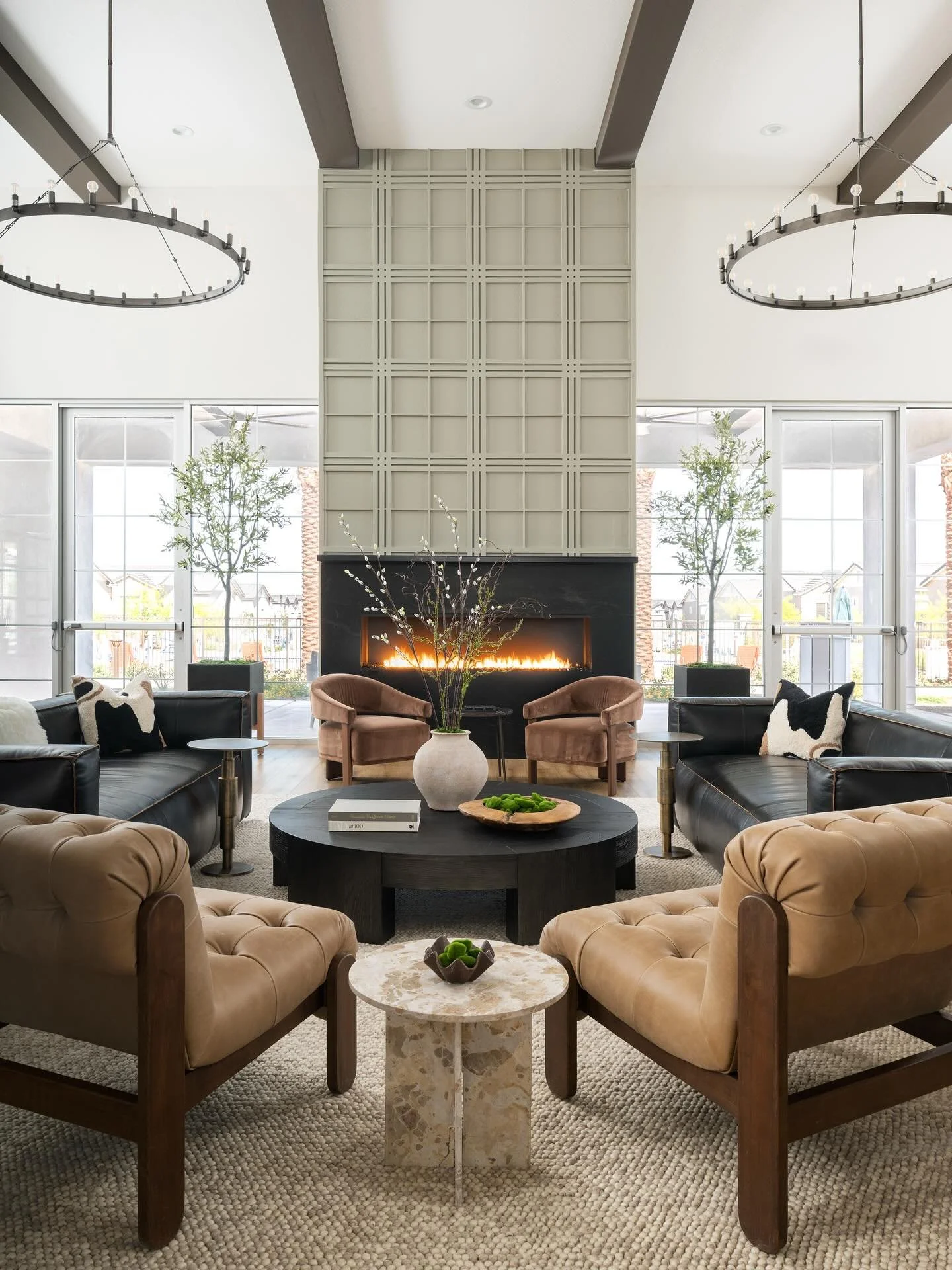 Warm tones, layered textures, and a fireplace that steals the show 🔥✨ Welcome to the heart of The Bungalows at Cotton Lane, where modern comfort meets timeless design. #TheBungalowsAtCottonLane #InteriorDesign #ModernLiving #CozyLuxury #DesignInspo 