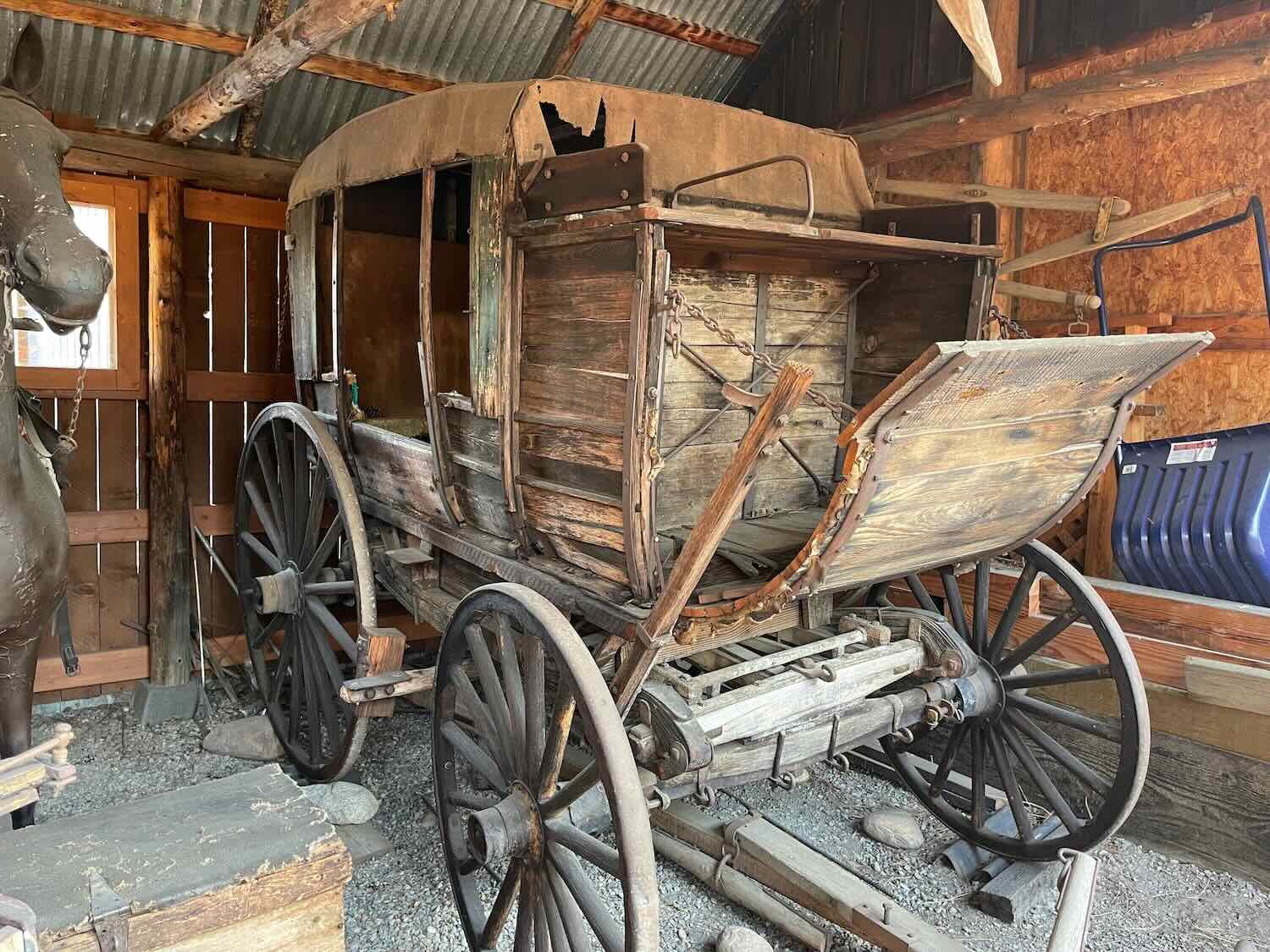 An old, wooden carriage on display at the history museum