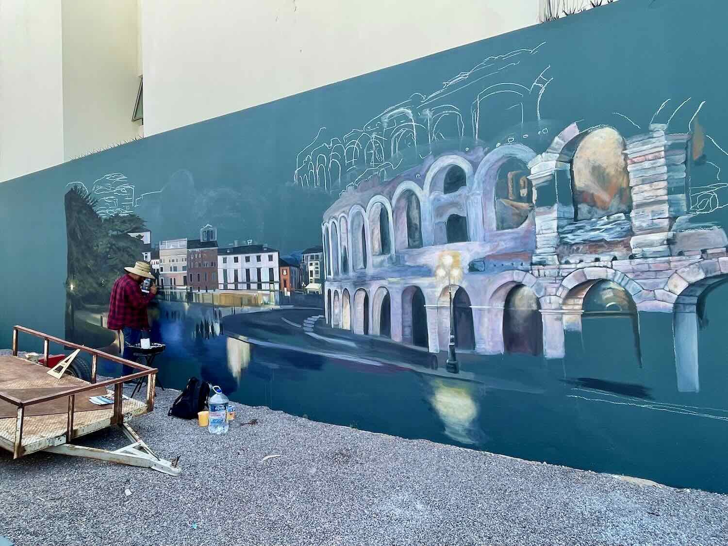 A new mural being created, depicting the Roman Colosseum