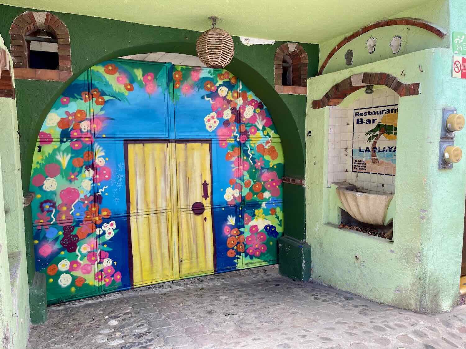 A more abstract floral arch decorates a doorway