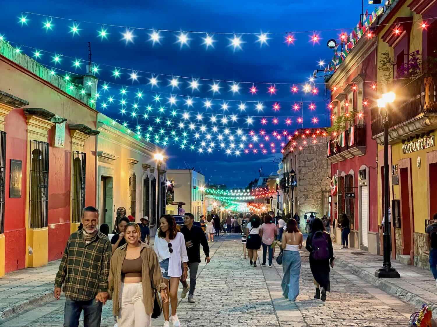 Strings of red, white and green lights illuminated many public spaces at night