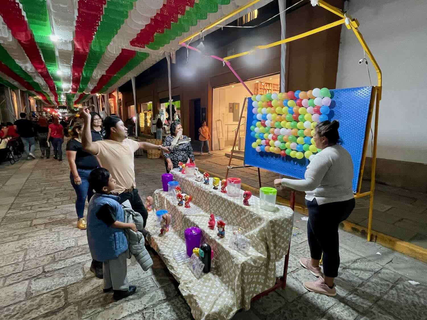 Free carnival games attracted crowds of folks hoping to win a toy for the kids