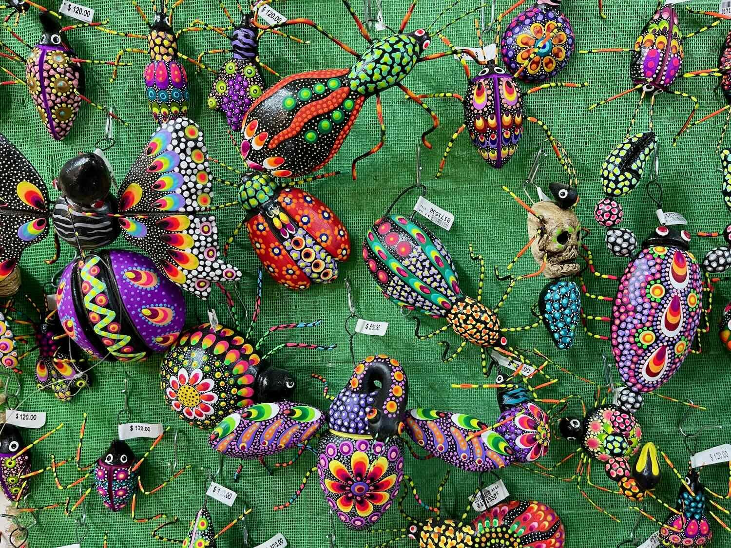 A shelf full of alebrije bugs