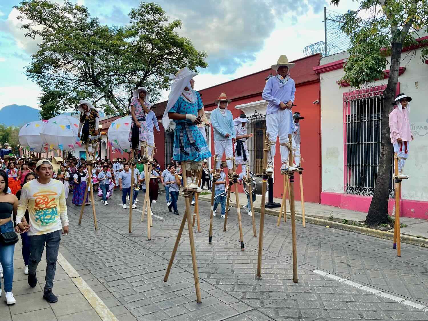 Stilt-walkers had their wooden stilts strapped to their feet with rope