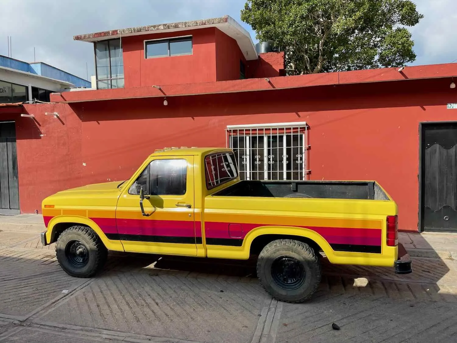 A brightly-colored pickup truck