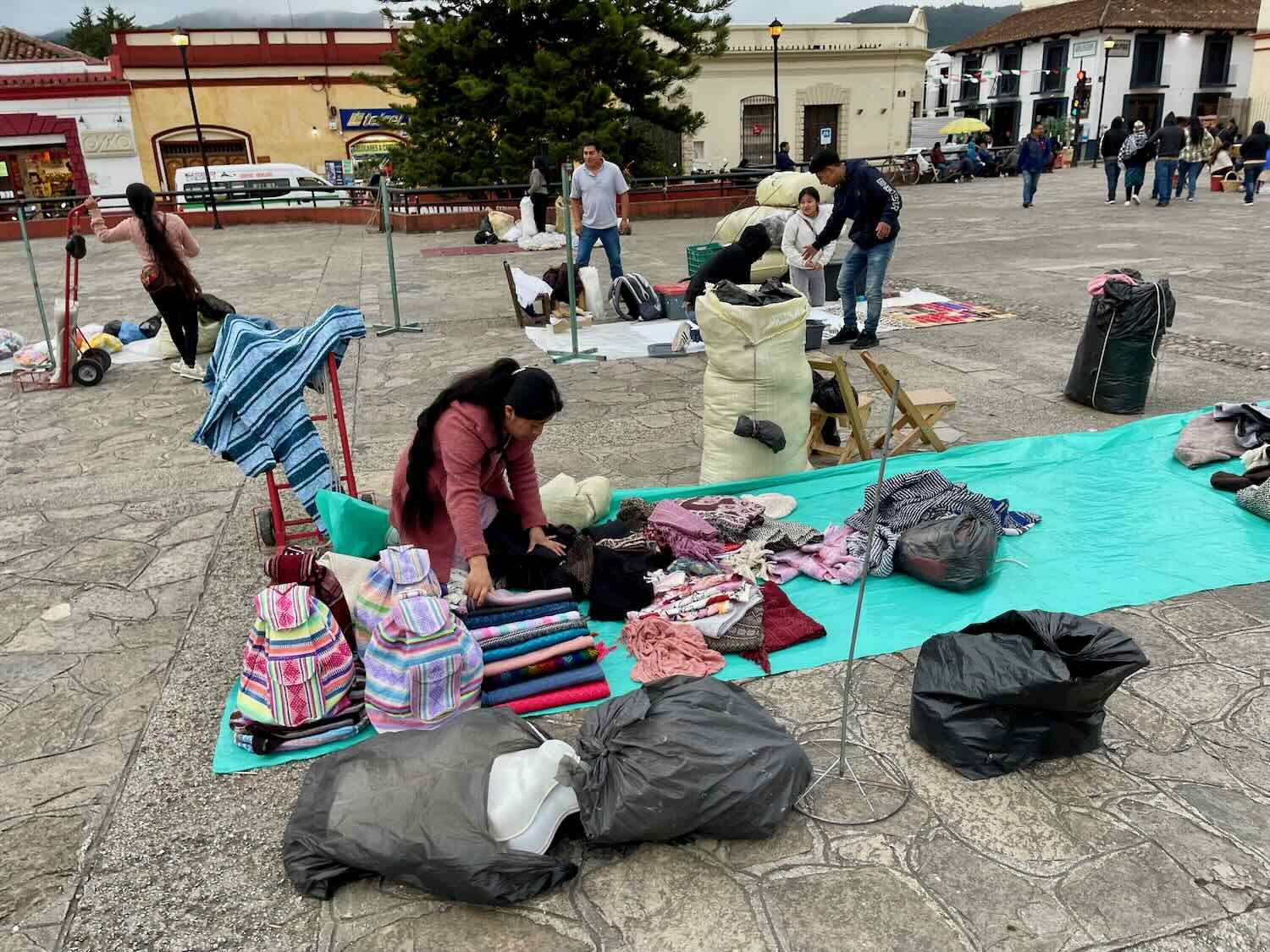 Setting out the merchandise on blankets in the plaza