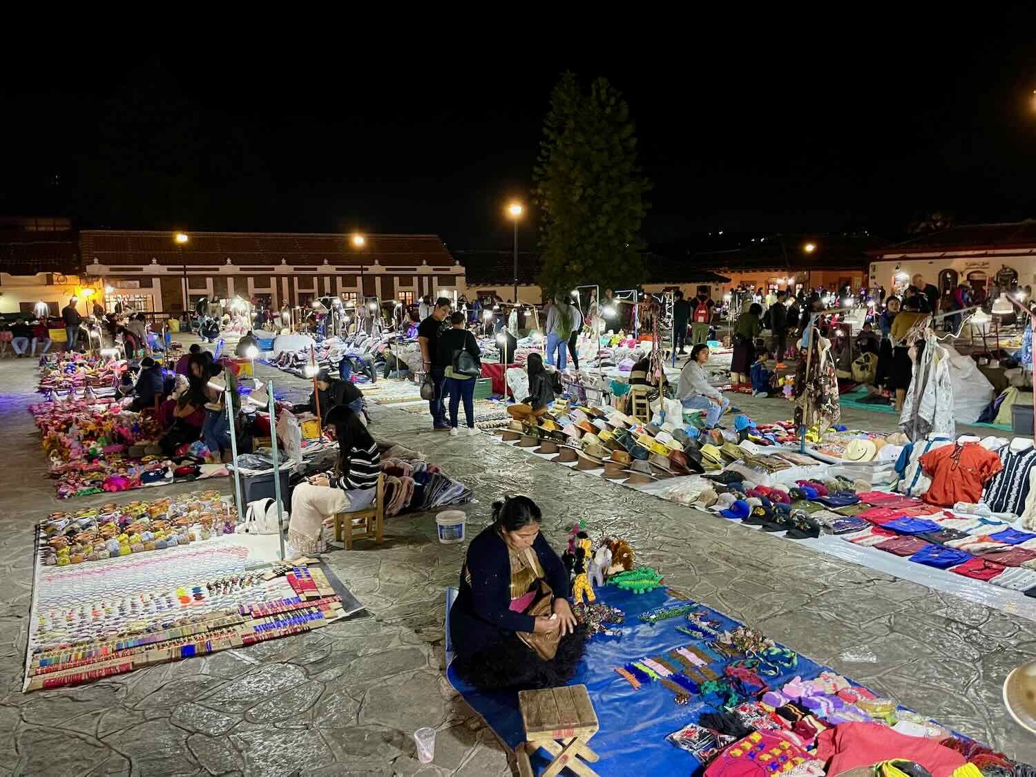 Vendors line up their blankets and arrange their merchandise from scratch every evening