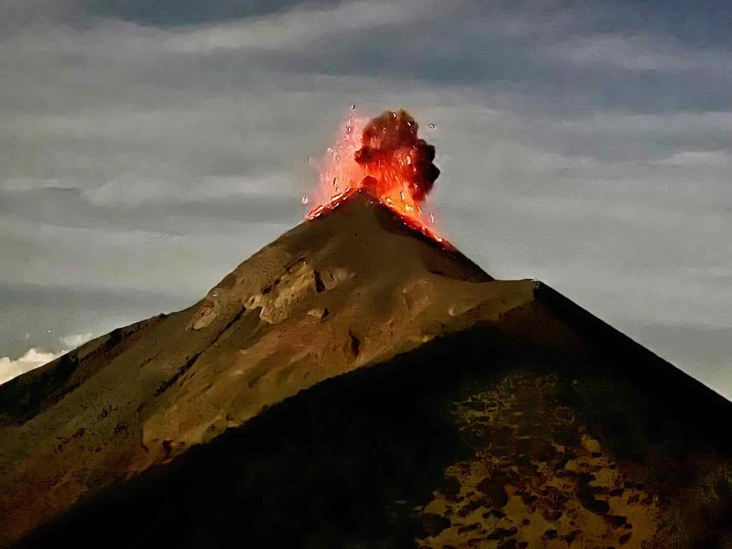 Molten rock shoots up into the sky from the Fuego Volcano