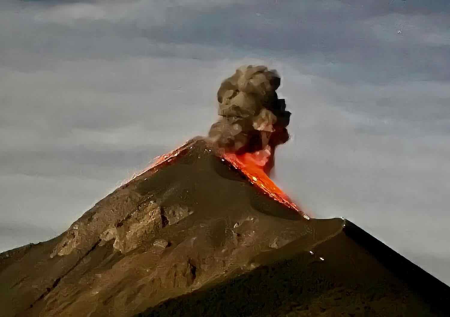 Hot lava flows down the slope of the Fuego Volcano