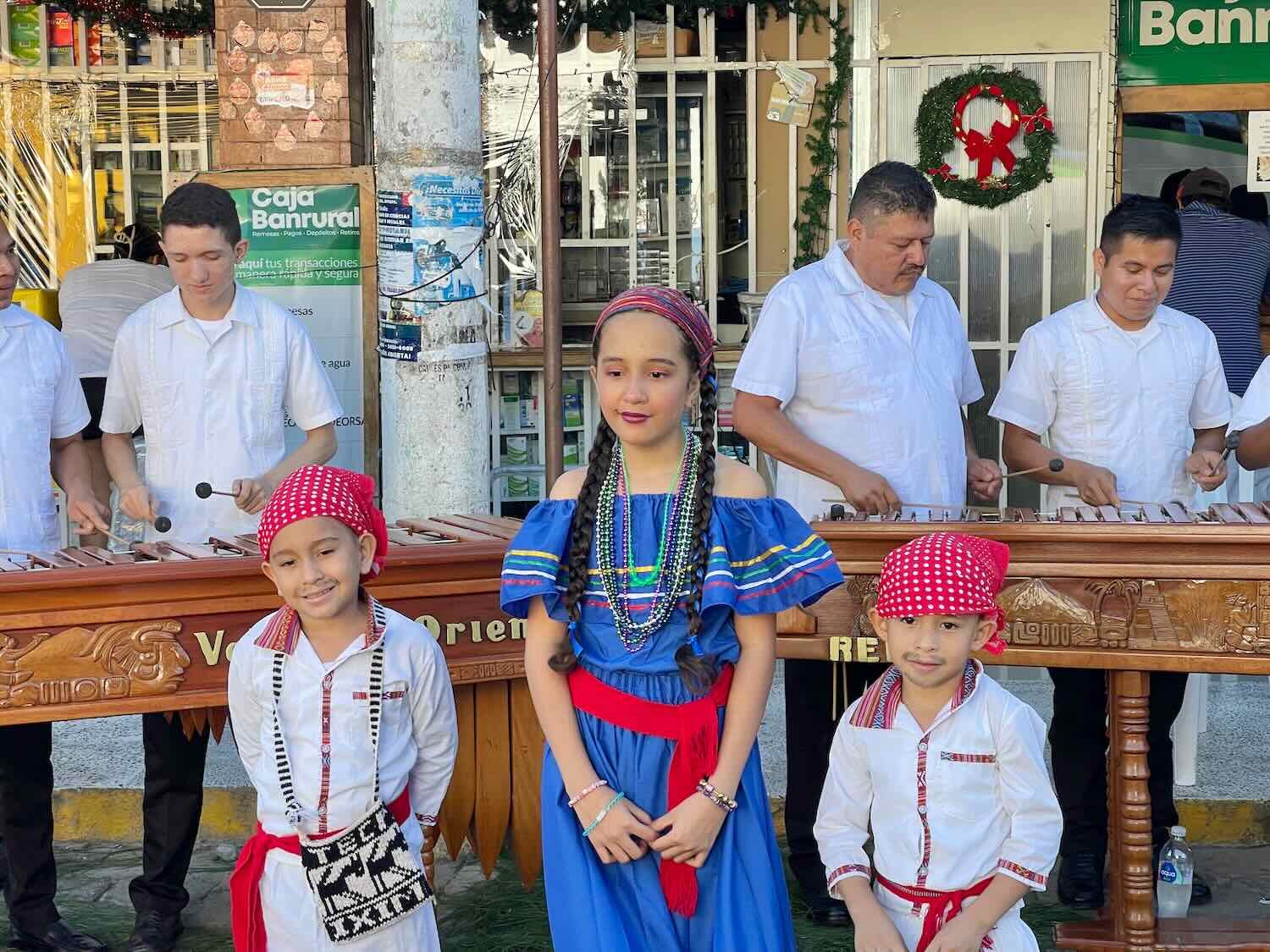 A big tradition on Virgin of Guadalupe Day in Guatemala is for girls to dress up in traditional costumes, and for the boys to dress up like Juan Diego (complete with whiskers drawn in black pencil).