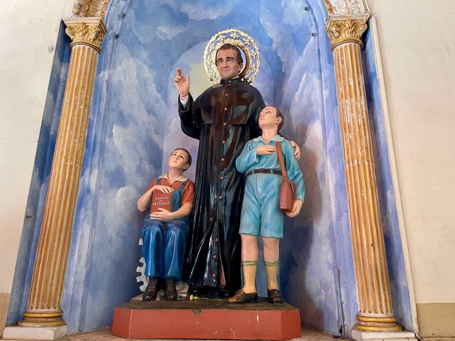 A statue of San Juan Bosco, who devoted his life to educating underprivileged children