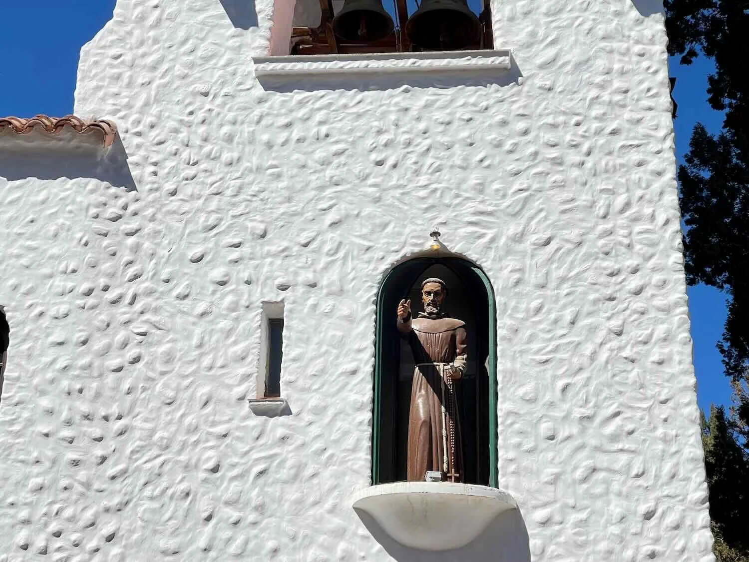 Each day at noon, a statue of St. Francis emerges from the clock tower to give a benediction for the crowd below.