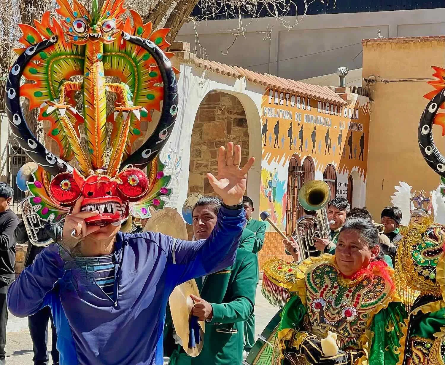 Trying on a Diablada Mask