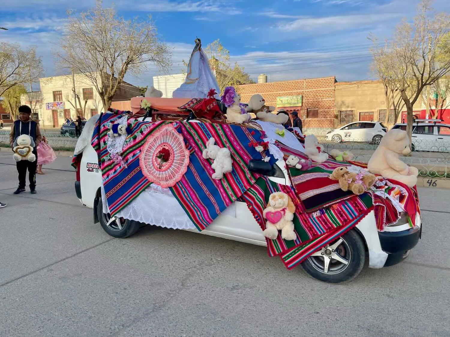 An image of the Virgin Mary rested atop a colorfully-decorated vehicle at the head of the parade.