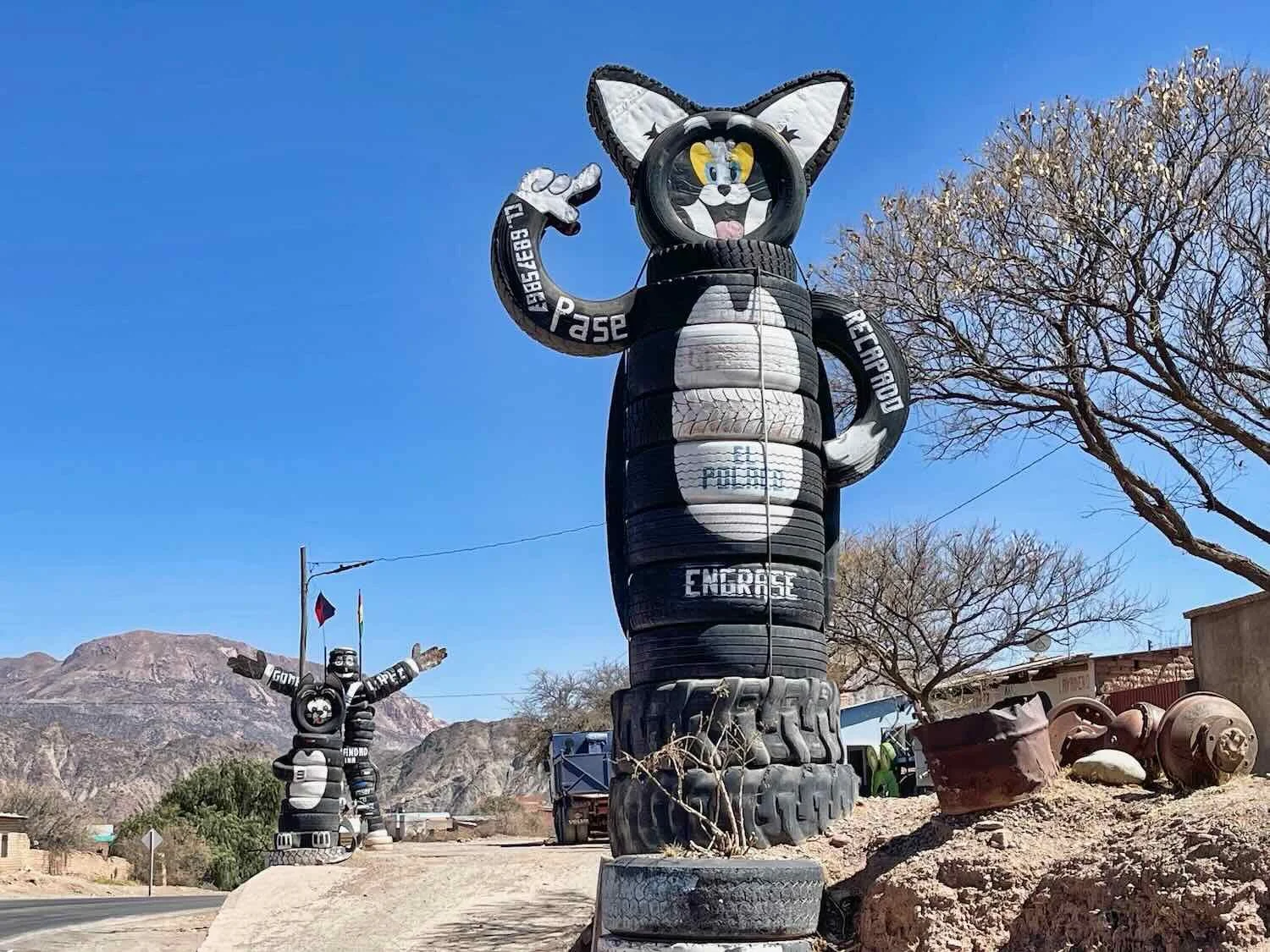 Tire sculptures advertising a tire repair shop.