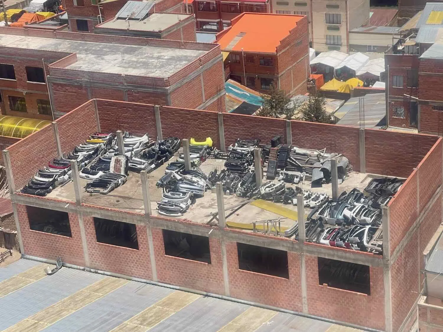 You never know what you'll see on a roof. This one was full of car bumpers.