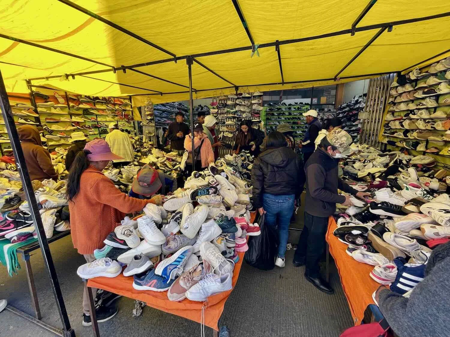Shoes were rarely matched into pairs. The thrill of the hunt kept shoppers sorting through the stacks of un-matched shoes.