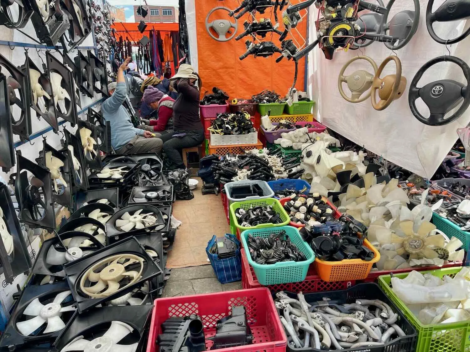 The market in El Alto is particularly famous for having tons of vendors selling used car parts.