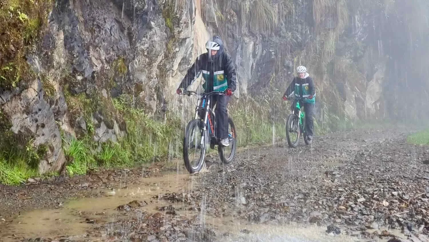 Then we hit the dirt. The road became narrow and rocky. In places the mountain was so steep that waterfalls rained down on us from above.