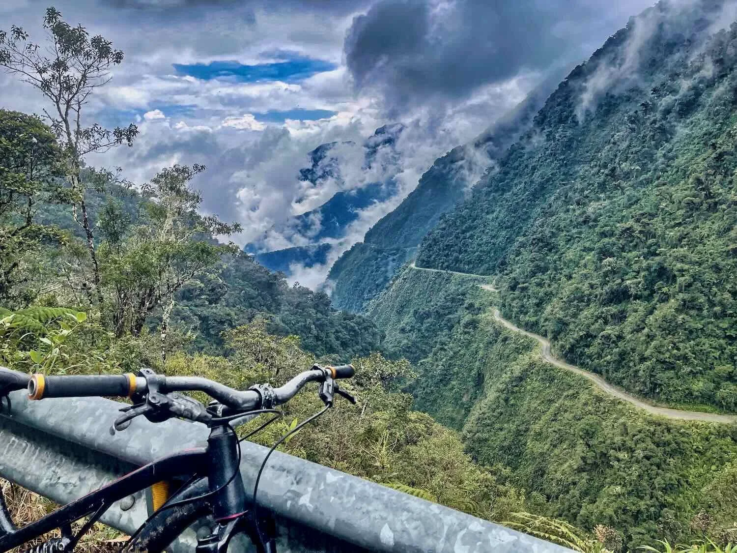 When we finally descended below the clouds, we found ourselves surrounded by thick, green jungle. You can see our road hugging the side of the mountain.